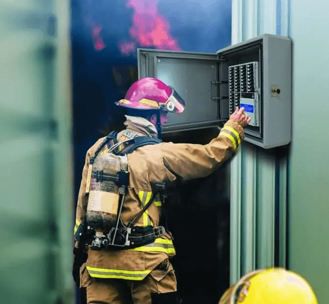 fire fighter operating EACIE panel